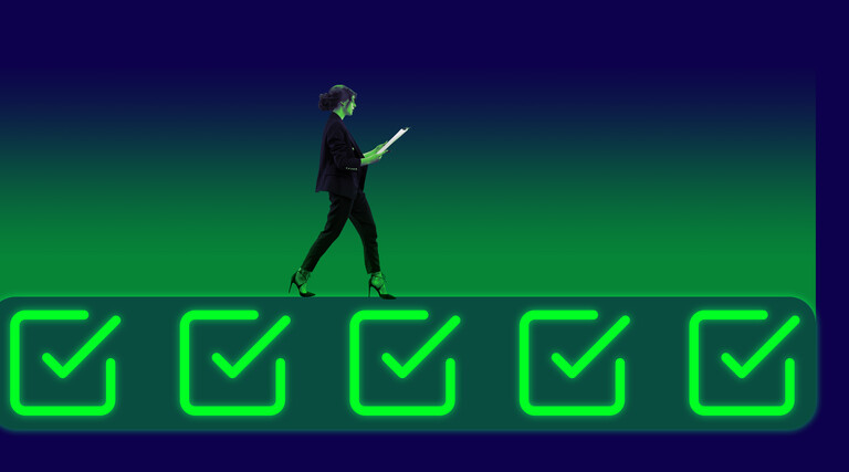 Businessperson walking on neon colored icons